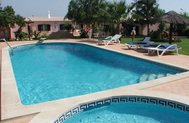 Apartment on a beautiful plot with pool near the sea