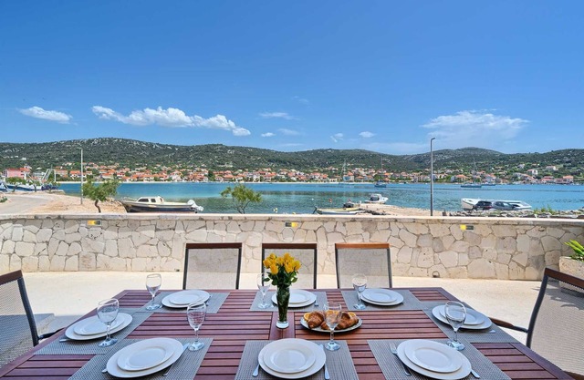 Beach House Joy - charming waterfront villa with a heated pool for 8 guests