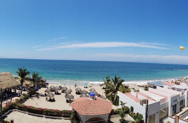 Beachfront Condo on Los Muertos Beach Next to Blue Chairs