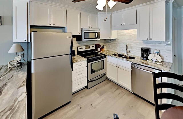 Beachfront Condo with an Outdoor Pool BBQ Area