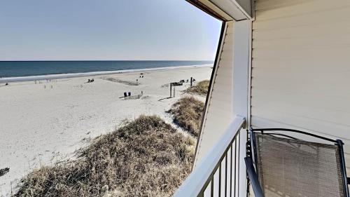 Beachfront Condo with an Outdoor Pool BBQ Area