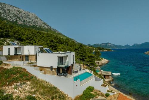 Beachfront villa Luce with seaview and pool