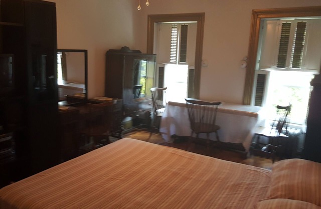 BEDROOM # 1 WITH AN EVENT SPACE AND BACK PORCH