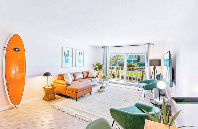 Boho-Chic Beachfront Escape: Pool, Private Balcony & Steps to the Pier