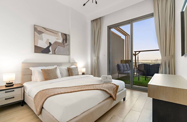 Bright 2BR Retreat | Balcony & Pool Near Jumeirah Village Circle