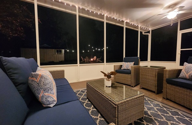 Bright and airy Mid-Century Modern home with screened porch and firepit.