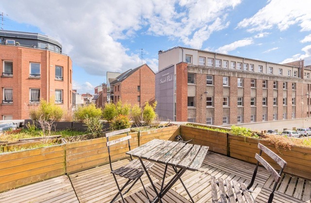Bright apartment with rooftop and private garage.
