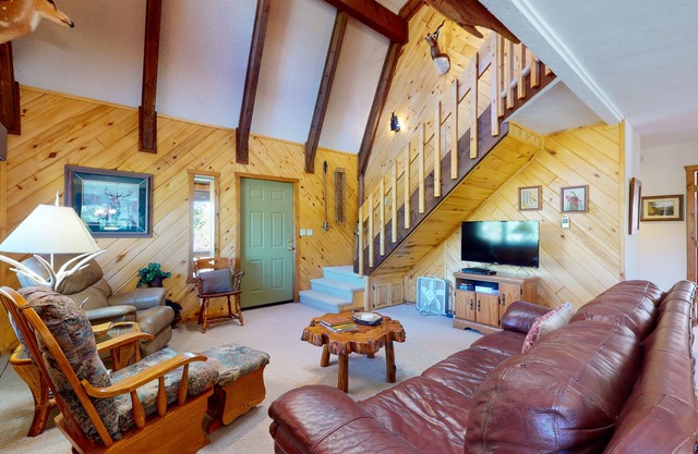Cabin retreat with wrap-around porch, work spaces,