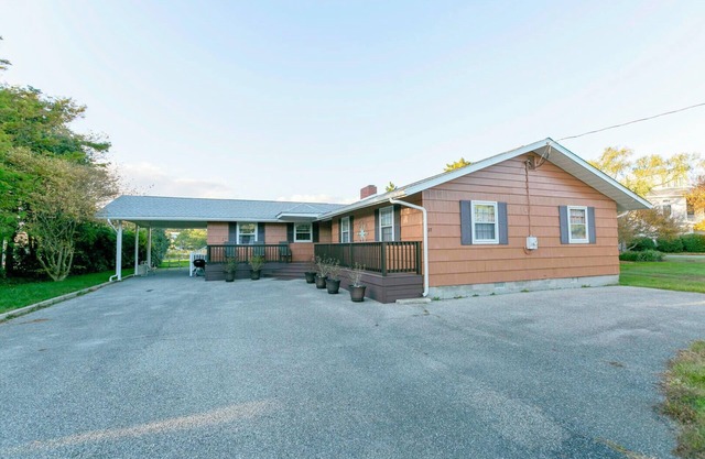 Canal-Front Retreat: 5BR Home w/Private Dock, Porch, Beach & Pool Access!