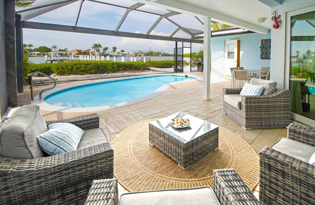 CAPRI PARADISE! Beautiful waterfront home. Private heated pool and dock