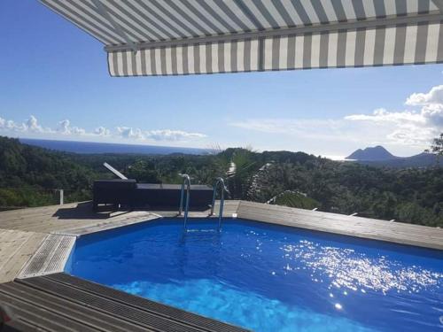 Chambre chez l'habitant avec piscine privative et vue panoramique sur la mer des caraïbes