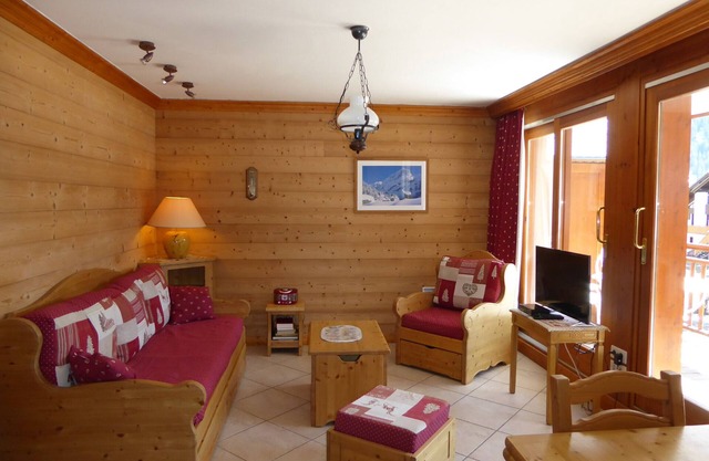 Charming 2-Bedroom Apartment with Large South Balcony, Parking, and Ski Storage