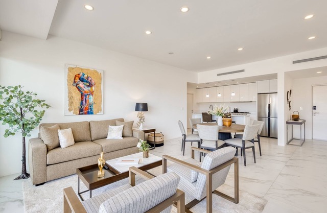 Coastal condo with Wifi, private W/D, and rooftop patio