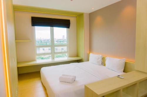 Comfortable and Modern Look 1BR at CitraLake Suites Apartment By Travelio