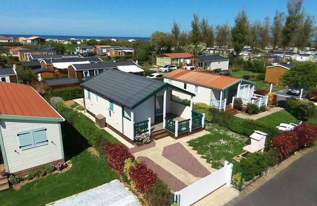 Comfortable chalet facing south in residential park, landing beaches