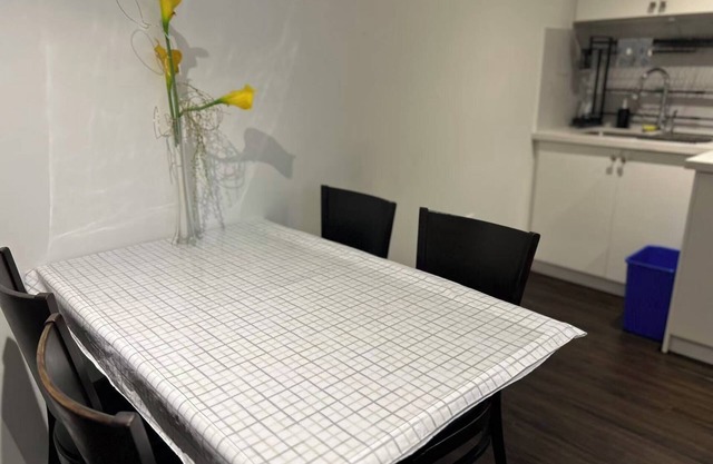 Comfortable Two Bedroom Basement Suite with Full Kitchen Bathroom and Queen Beds