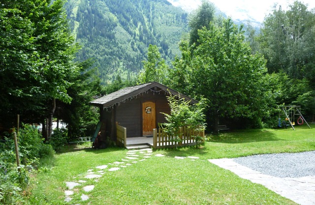 Cosy Alpine chalet for two with log fire in peacefull gardens.