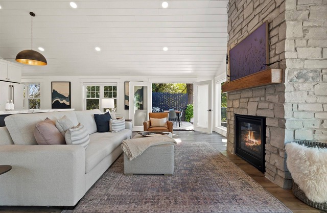 Custom Home with Lake Views + Cozy Fireplace