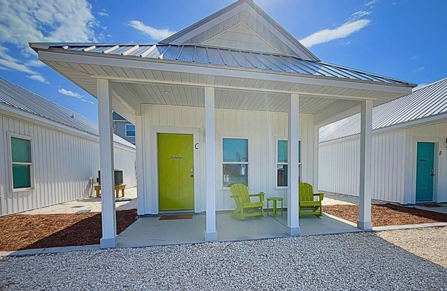 "Dolphin Cottage" is a pet friendly, 2 bed, 1 1/2 bath unit accepting 5 guests. Community Pool.