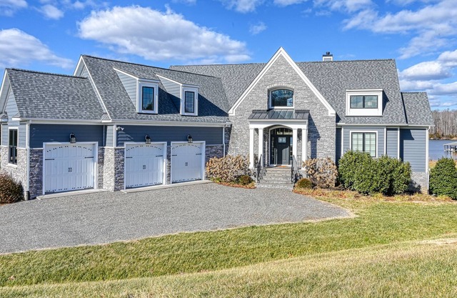 Elegant lakefront home with water access, hot tub, dock, rec room & fireplaces