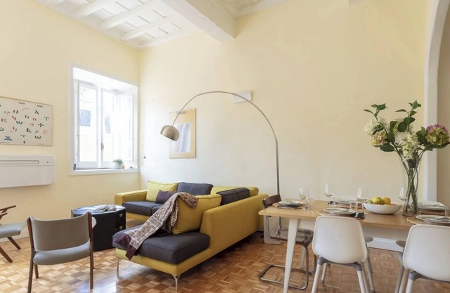 Elegant Roman Apartment with Rooftop Access & Landmark Views