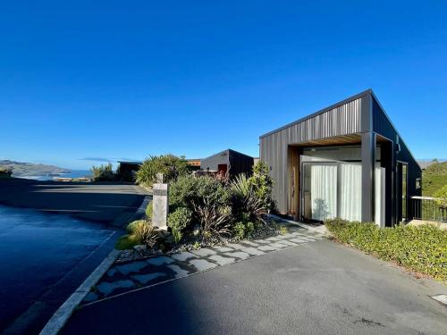 Elevated architectural home with stunning sea views