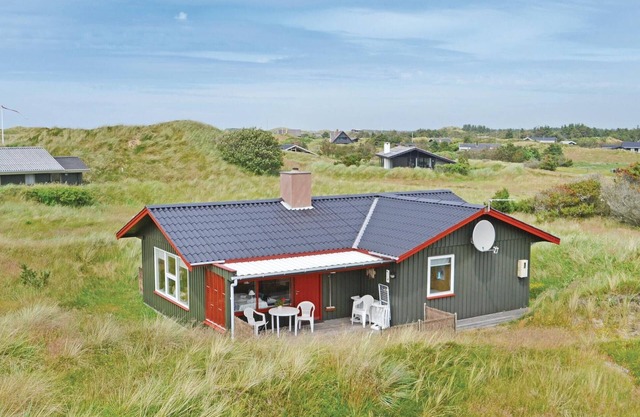 Enjoy a relaxing holiday by the sea in this charming holiday home in the dunes.