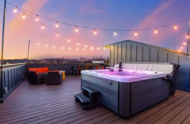 Fall hot tubs, rooftop decks, game rooms near Broadway and Geodis Park