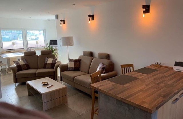 First floor vacation apartment on approx. 78 sqm, high-quality and modern furnishings with furnished terrace with garden pond and barbecue facilities, covered e-bike charging station and lockable bicycle room. You can look forward to: a fully equipped.