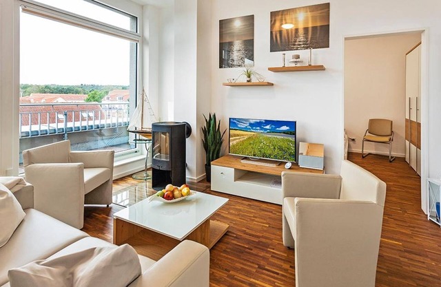 Great penthouse apartment with roof terrace and wood-burning stove - only 150 m to the beach!