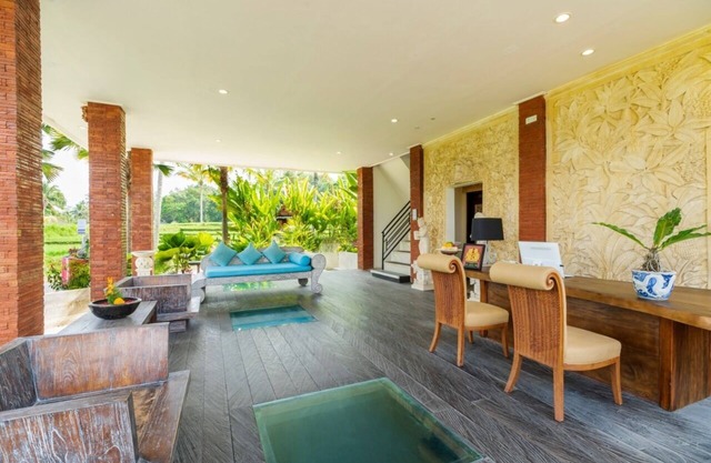 Hidden villa surrounded by lush rice fields