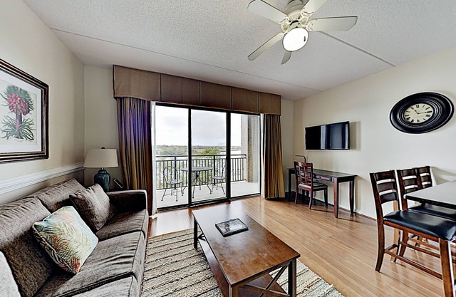 Historic district condo with private riverfront balcony, walk to shops & dining