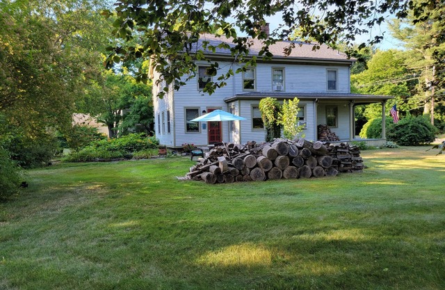 Historic Madison Home on lovely 1.2 acre setting and 5 minutes to private beach.