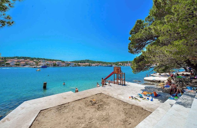 Holiday apartment with children's playground and pool