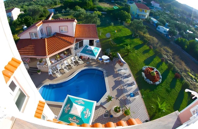 Holiday apartment with pool, fireplace and sea view