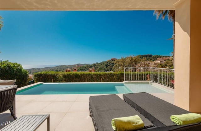 Holiday home with private garden, heatable private pool, and sea views