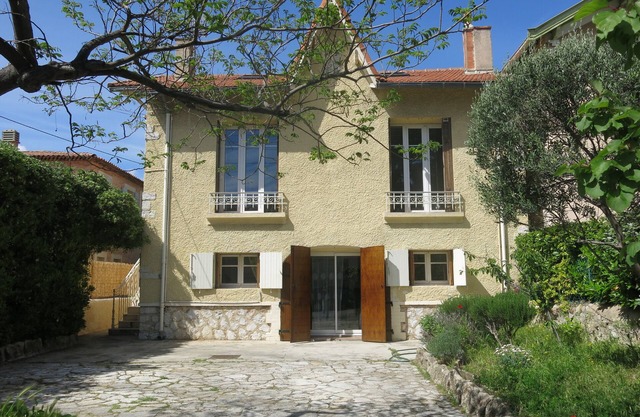 House with garden on a hill