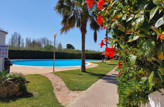Ibiza-style vacation home with terrace right on the beach. Great pools.