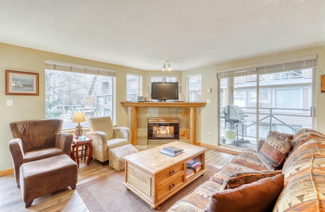 Ideal first-floor getaway with hot tub, fireplace, & balcony - walk to lifts
