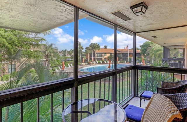 Island-style condo w/ two heated pools & brief walk to beach