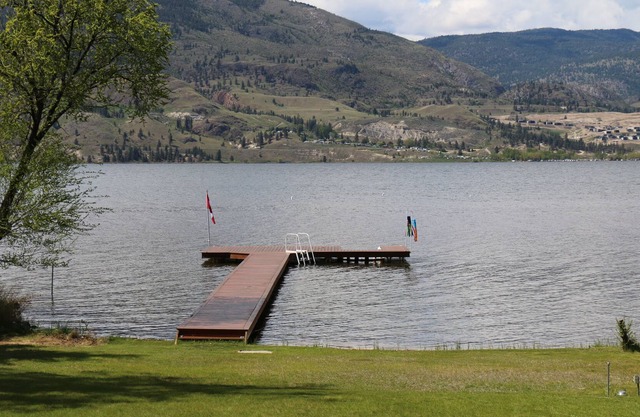 Lakefront home on Skaha Lake with private dock.