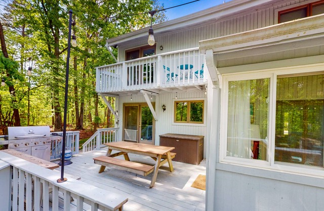 Lakefront home with hot tub, WiFi, dock, lake views, AC, & wood fireplace