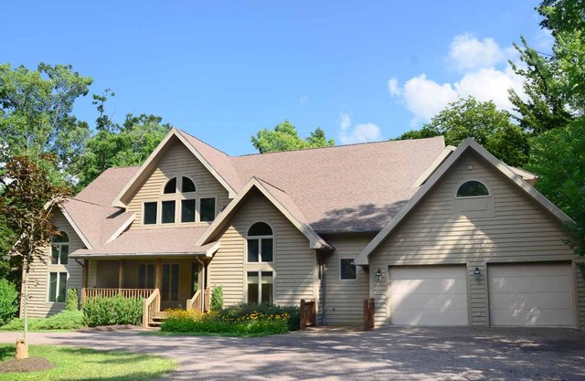 Lakefront & pet friendly home in tranquil wooded community w/ private dock!