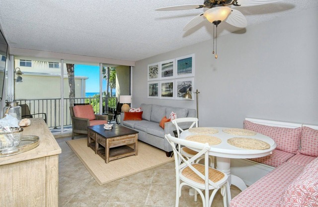 LaPlaya 202E-Catch the gentle Gulf breezes on your private balcony beneath the swaying palms.