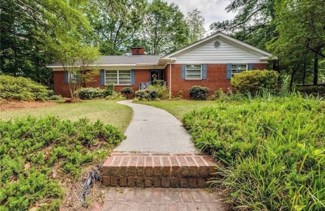 Large charming 4 bedroom, 3 bath on quiet wooded lot with lots of space for all!