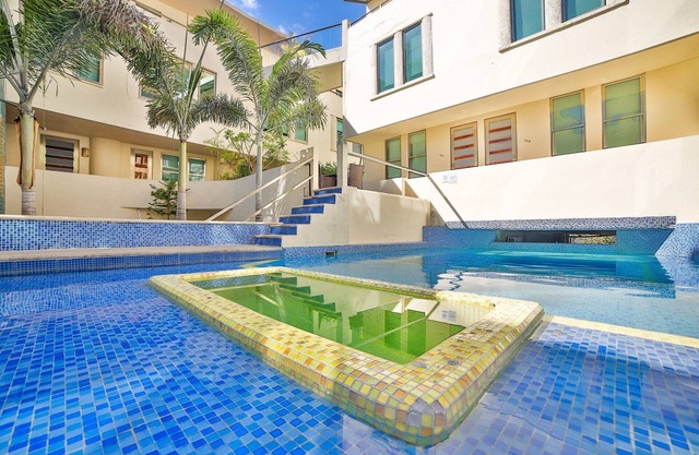 Large, Modern Condo w/ Balcony overlooking 5th Ave. 4 min. Walk to the Beach!
