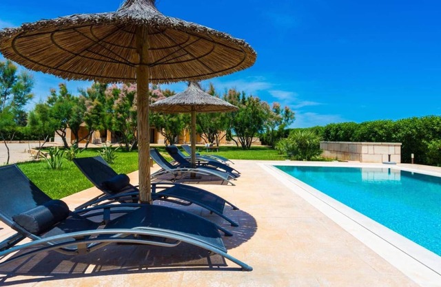 Large pool with a jacuzzi.