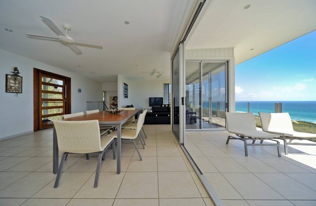 Luxurious beach house high above Home Beach with 180 degree ocean and.