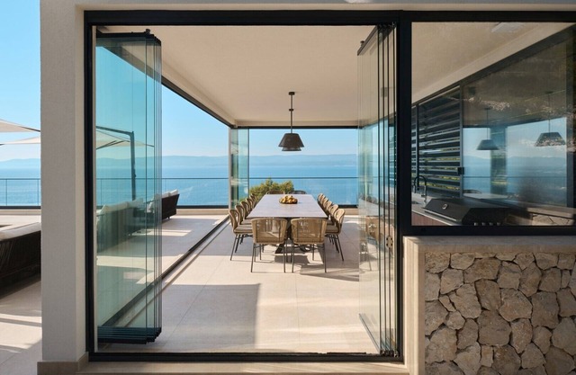 Luxurious Villa Deluxe Mimice by the sea with heated outdoor and indoor pools, sauna, and gym for 20 people.