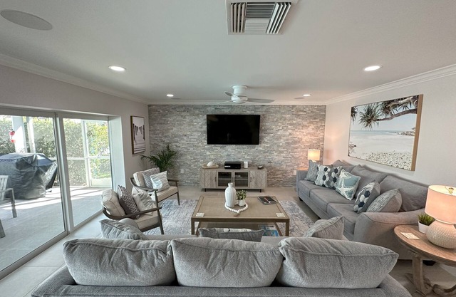 Luxurious Waterfront Retreat! Oversized Heated Pool and expansive outdoor area!